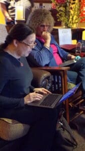 Jennifer Rupp Reading on Laptop